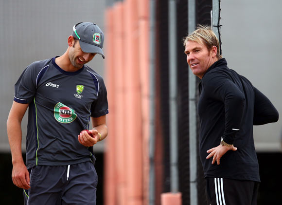 Nathan Lyon (left) with Shane Warne during the Australian nets session in Manchester.