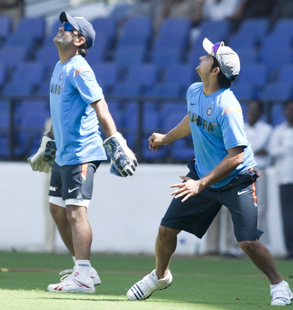 Indian captain MS Dhoni and Suresh Rainia during a practise session