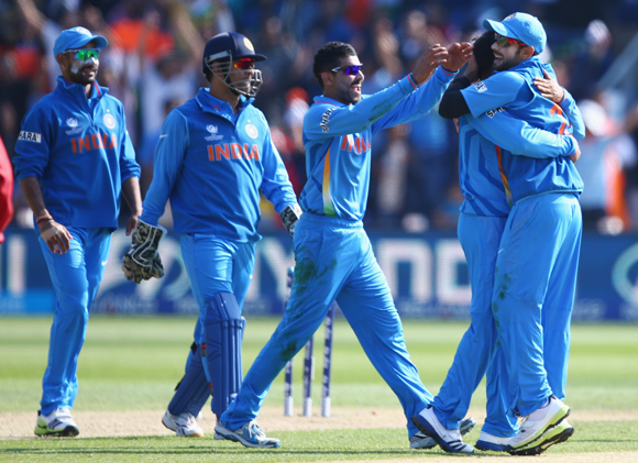 Ravindra Jadeja (C) of India leads the celebrations after a wicket
