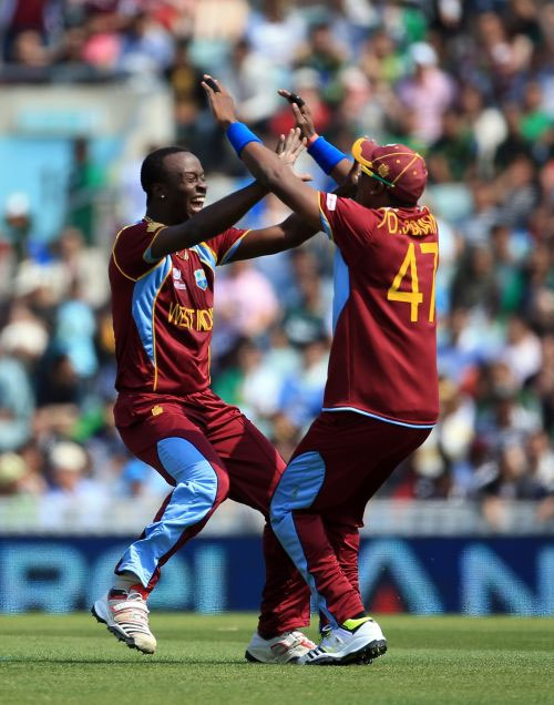  Kemar Roach celebrates after picking a wicket 