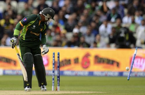 Pakistan's Imran Farhat is bowled by South Africa's Chris Morris during the ICC Champions Trophy group B match at Edgbaston cricket ground in Birmingham
