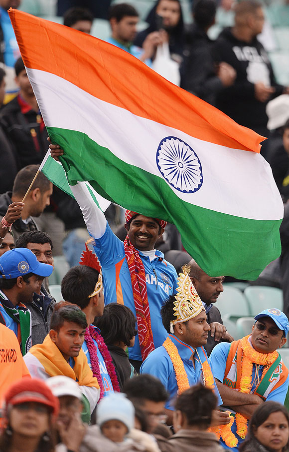 Indian fans celebrate India's win over West Indies on Tuesday