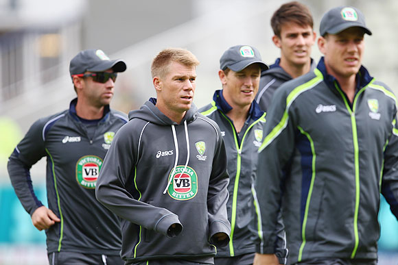 David Warner (2nd from left) warms up with his Australia teammates 