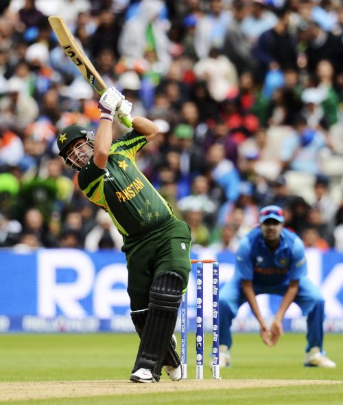 akistan's Kamran Akmal hits out during the ICC Champions Trophy group B match against India at Edgbaston cricket ground