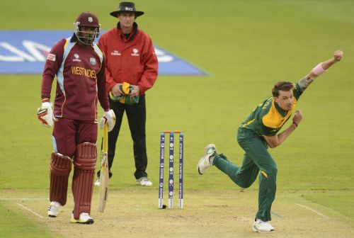 South Africa's Dale Steyn bowls as West Indies' Chris Gayle (left) and umpire Rod Tucker (centre) look on