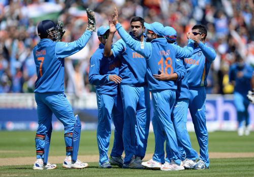 Indian team celebrate at the fall of a wicket