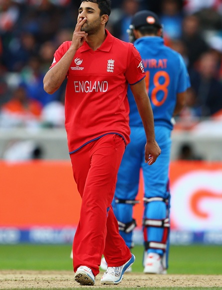 Ravi Bopara of England celebrates taking the wicket of Shikhar Dhawan
