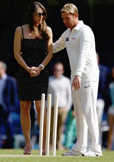 Elizabeth Hurley and Shane Warne look on during the Shane Warne's Australia vs Michael Vaughan's England T20 match