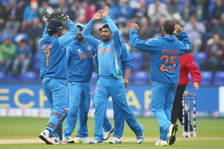 Ravindra Jadeja celebrates with teammates after taking a wicket