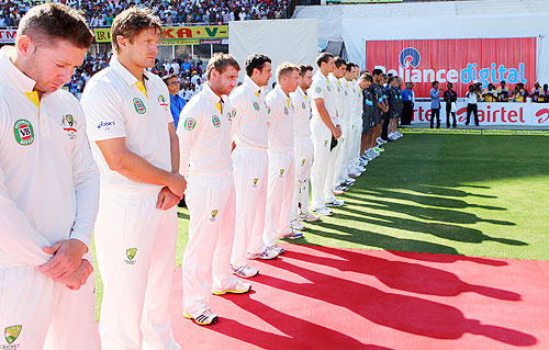 The Australian cricket team lines up for a minute's silence, before start of play on Day 2 on Sunday, to honour those injured in the explosions in Hyderabad last week