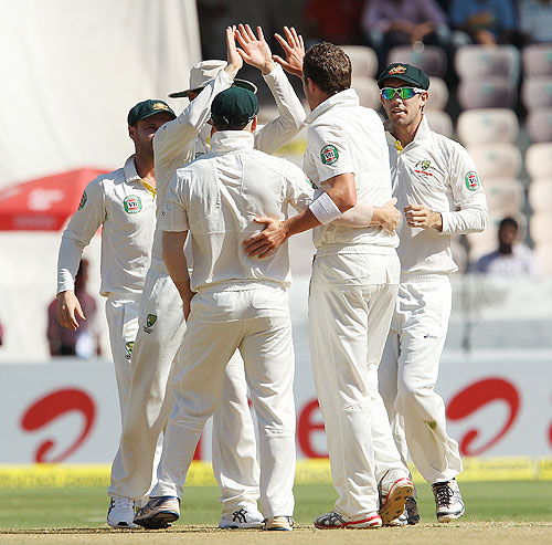 Peter Siddle celebrates the wicket of Virender Sehwag