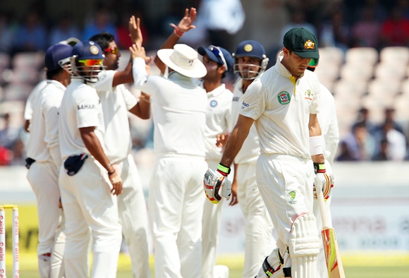 Indian players celebrate as Glenn Maxwell departs