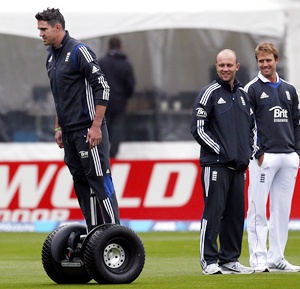 England cricket team player Kevin Pietersen (left) rides a Segway past teammates Jonathan Trott (centre) and Nick Compton