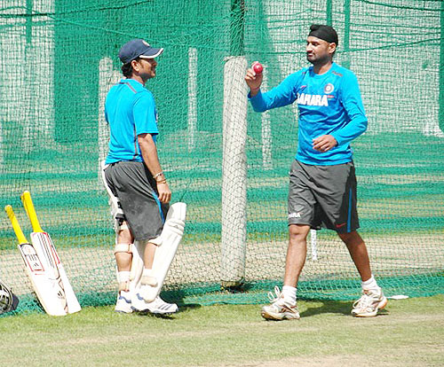 Sachin Tendulkar and Harbhajan Singh share notes at the nets