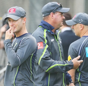 Australian captain Michael Clarke (left) looks on as coach Mickey Arthur talk