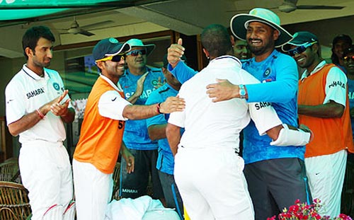Shikhar Dhawan is congratulated by team mates