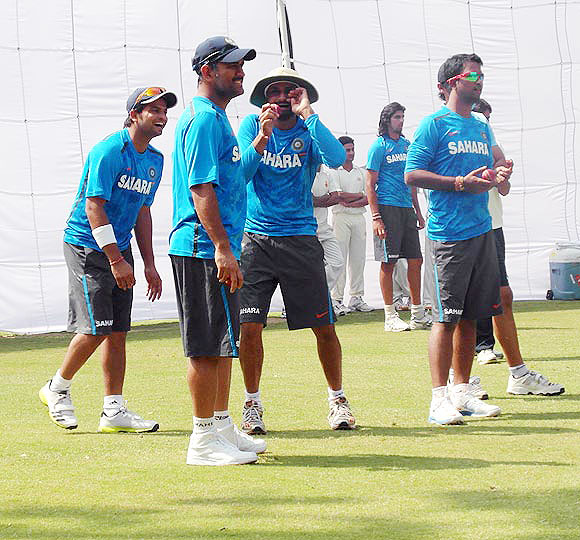 Harbhajan Singh jokes with captain Mahendra Singh and other players