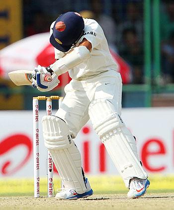 Ajinkya Rahane gets knocked in the head off a short delivery during his innings on Day 2