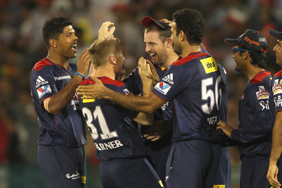 Umesh Yadav of Delhi Daredevils and David Warner of Delhi Daredevils congratulate Ben Rohrer of Delhi Daredevils for taking the catch to get Jacques Kallis of Kolkata Knight Riders wicket off Irfan Pathan