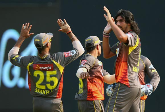 Ishant Sharma celebrates with team mates after getting the wicket of Dinesh Karthik