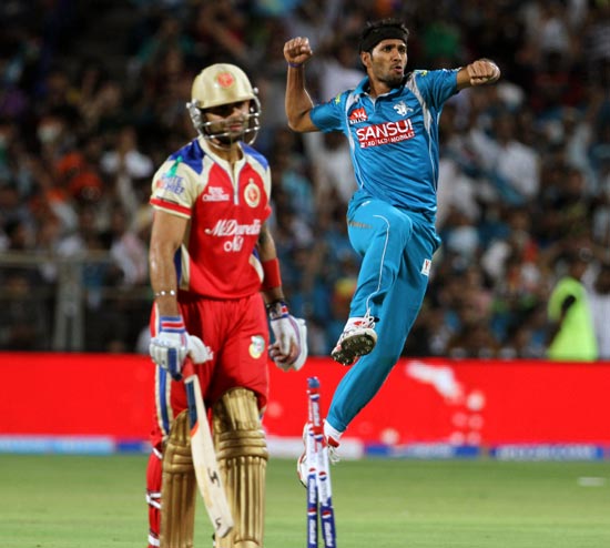 Ashok Dinda celebrates after taking the wicket of Virat Kohli