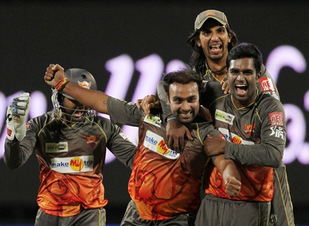 Amit Mishra is congratulated by Ishant and teammates