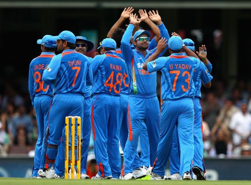 The Indian team celebrate a wicket