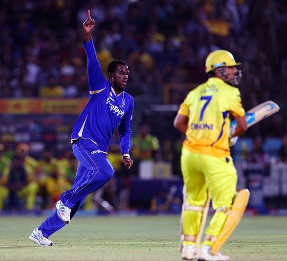 Kevon Cooper celebrates the wicket of Mahendra Singh Dhoni