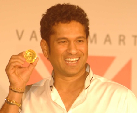 Tendulkar displays the gold coin