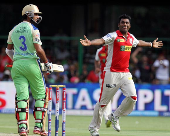 Parvinder Awana celebrates the wicket of Cheteshwar Pujara