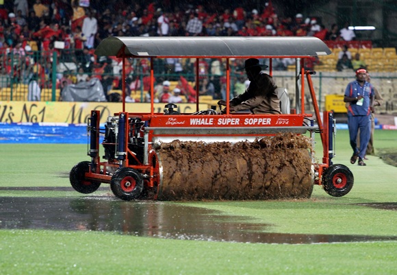 PIX: Fans frustrated as rain plays spoilsport in Bangalore