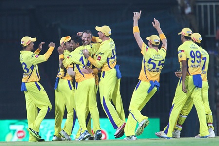 Chennai Super Kings player celebrate the fall of a wicket