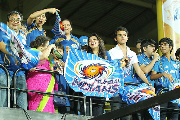 Mumbai Indians fans cheer during an IPL match