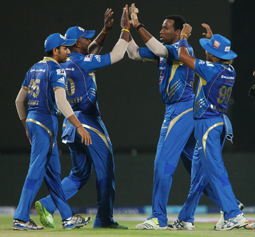 Kieron Pollard and Dwayne Smith celebrate the wicket of Murali Vijay