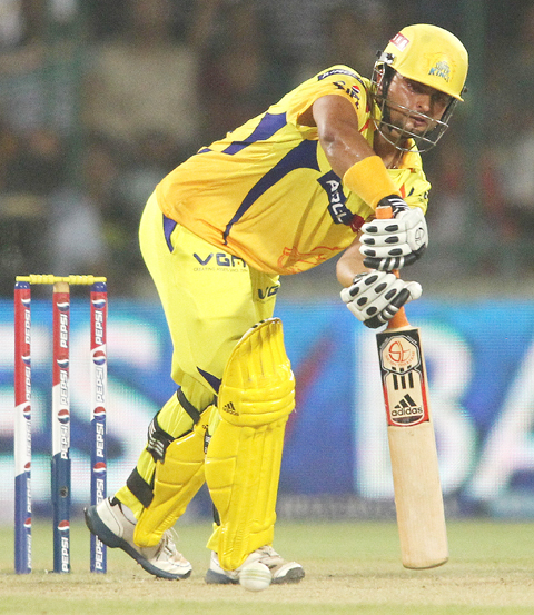Suresh Raina of the Chennai Super Kings punches a delivery through the leg side