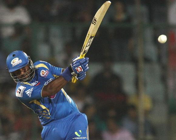 Dwayne Smith of Mumbai Indians hits over the top for six