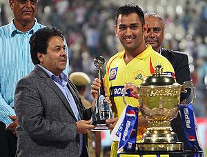 Chennai Super Kings captain, MS Dhoni, accepts the fair play award after the IPL final on Sunday