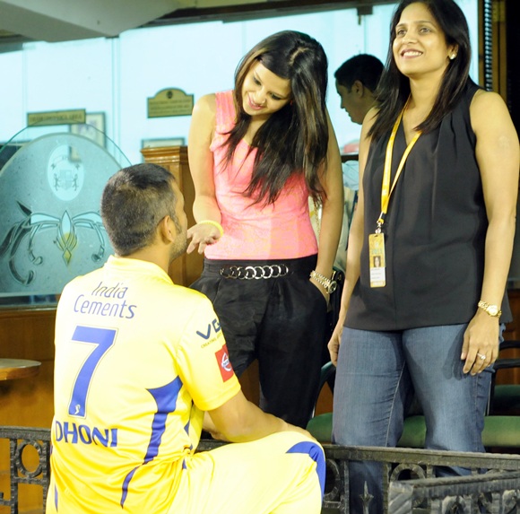 MS Dhoni with wife Sakshi (left)