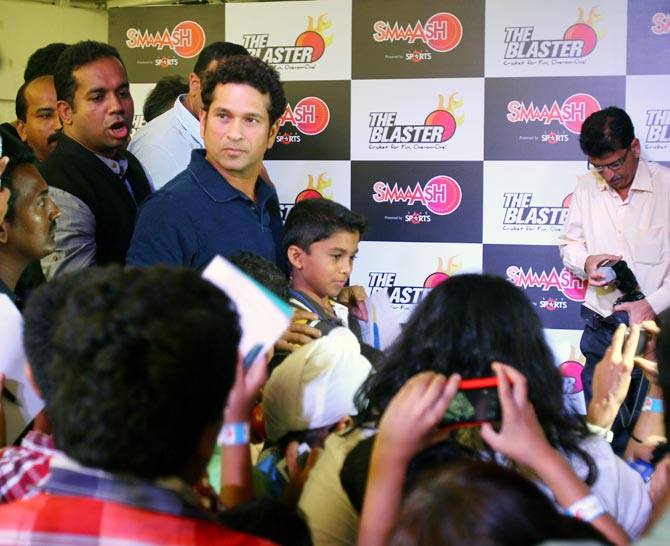 Sachin Tendulkar interacts with fans during a promotional event in Mumbai