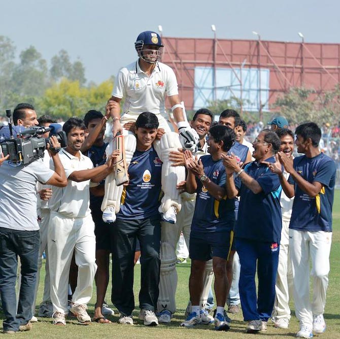 Sachin Tendulkar is chaired off the ground by his Mumbai teammates after victory over Haryana, in Lahli