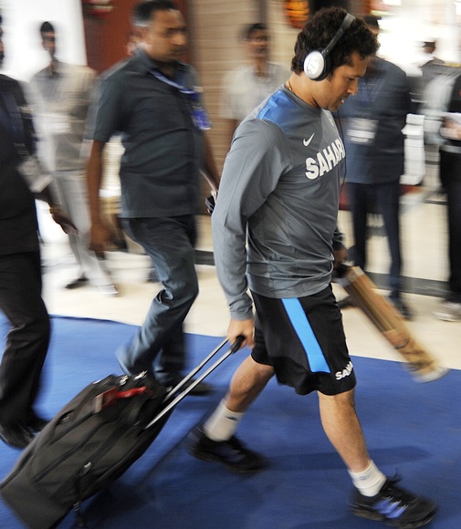 Sachin Tendulkar walks in to the stadium as Indian team arrives on Day 1 of the first Test at the Eden Gardens in Kolkata