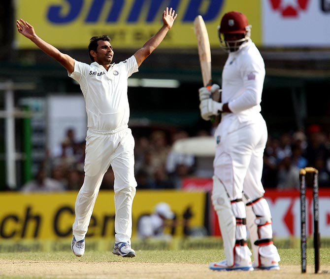 Mohammed Shami celebrates getting the wicket of Sheldon Cottrell