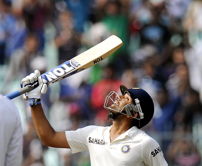 Rohit Sharma celebrates on completing his half century