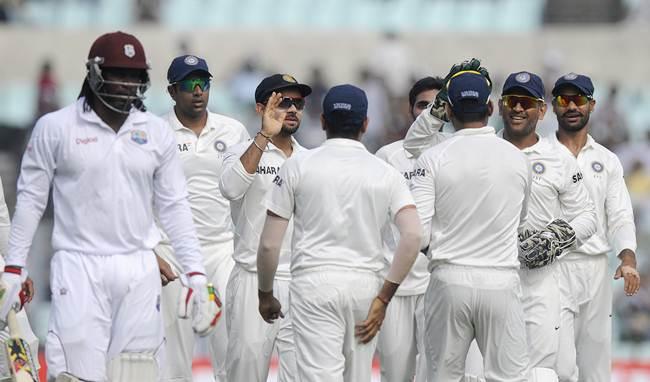 Indian players celebrate after Chris Gayle is dismissed