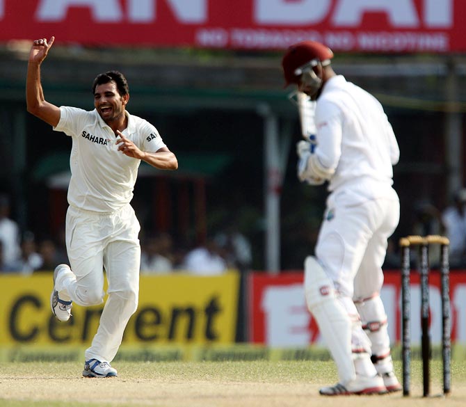 Mohammad Shami celebrates as Marlon Samuels is given out leg before wicket