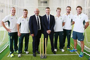 Brad Haddin, David Warner, Darren Lehman, Michael Clarke, Steve Smith, Nathan Lyon and Ryan Harris pose for a photograph after the Australia Test Squad announcement at the National Cricket Centre in Brisbane on Monday
