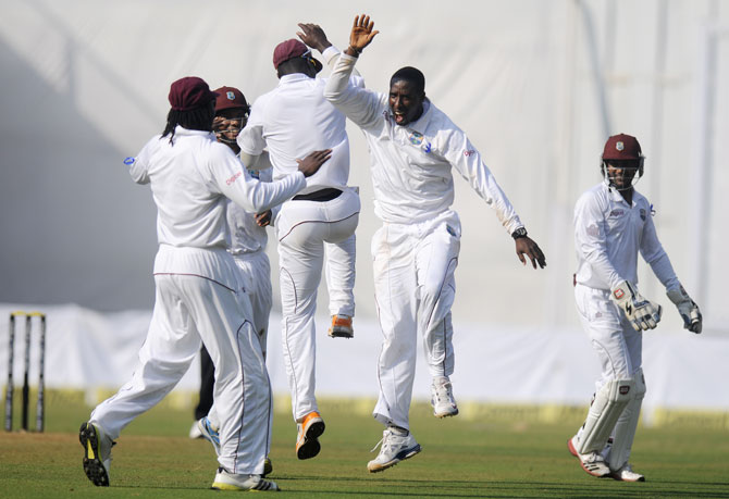 Shane Shillingford of West Indies celebrates the wicket of Murali Vijay