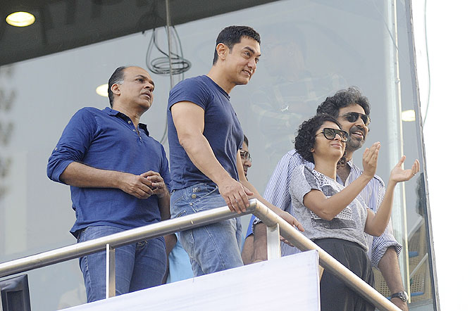Actor Aamir Khan with wife Kiran Rao and director Ashutosh Gowarikar at the Wankhede on Friday