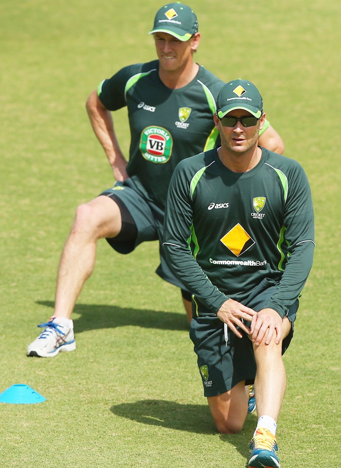 Michael Clarke and George Bailey stretch during an Australian nets session