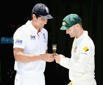 England captain Alastair Cook and Australia captain Michael Clarke hold a replica of the Ashes urn during an Ashes captain's photocall at The Gabba in Brisbane